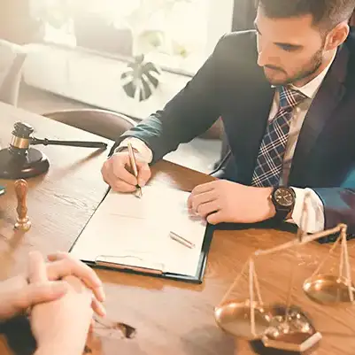 A laywer writing out a contract.